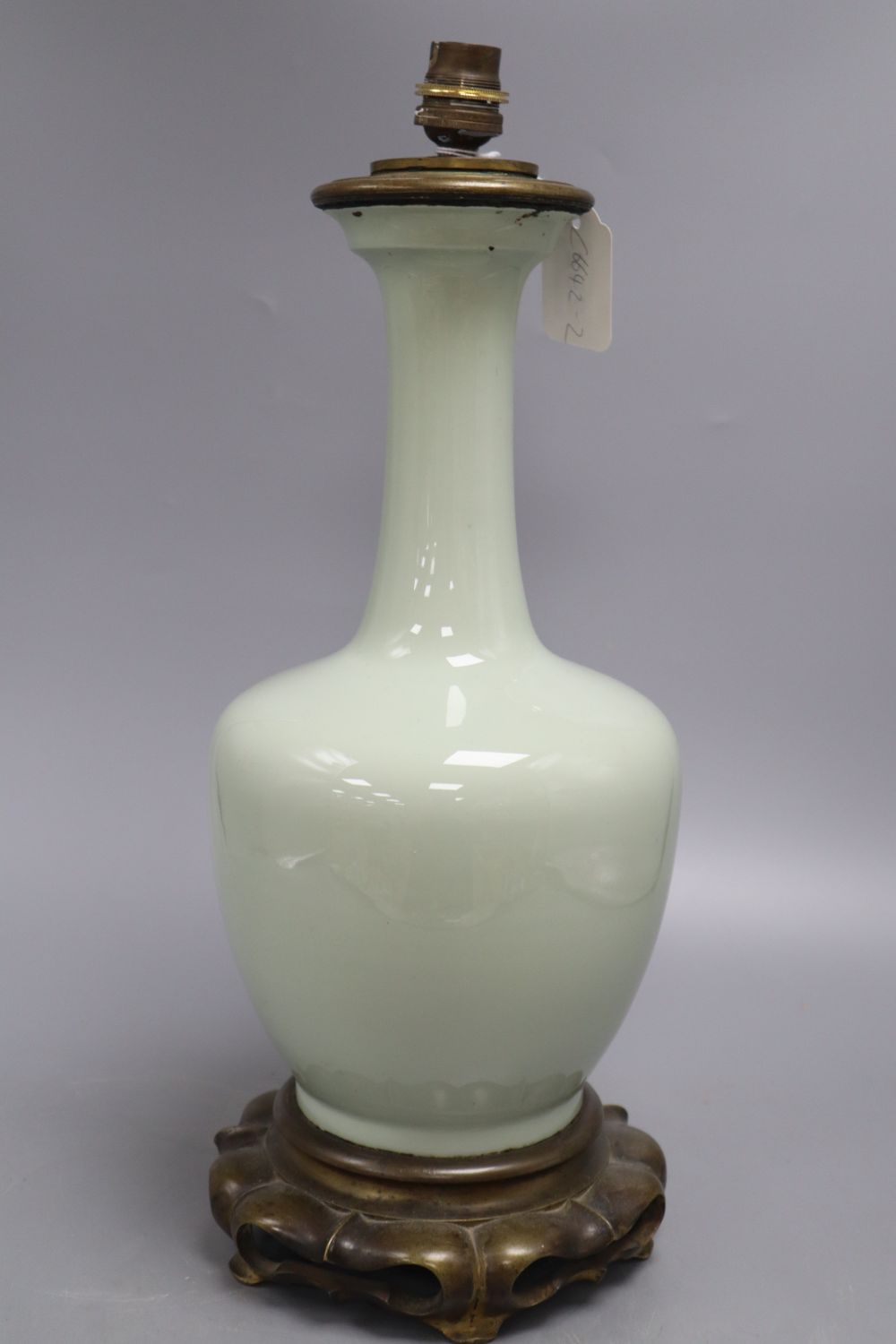 A Chinese celadon vase, mounted in bronze as a lamp, height 39cm